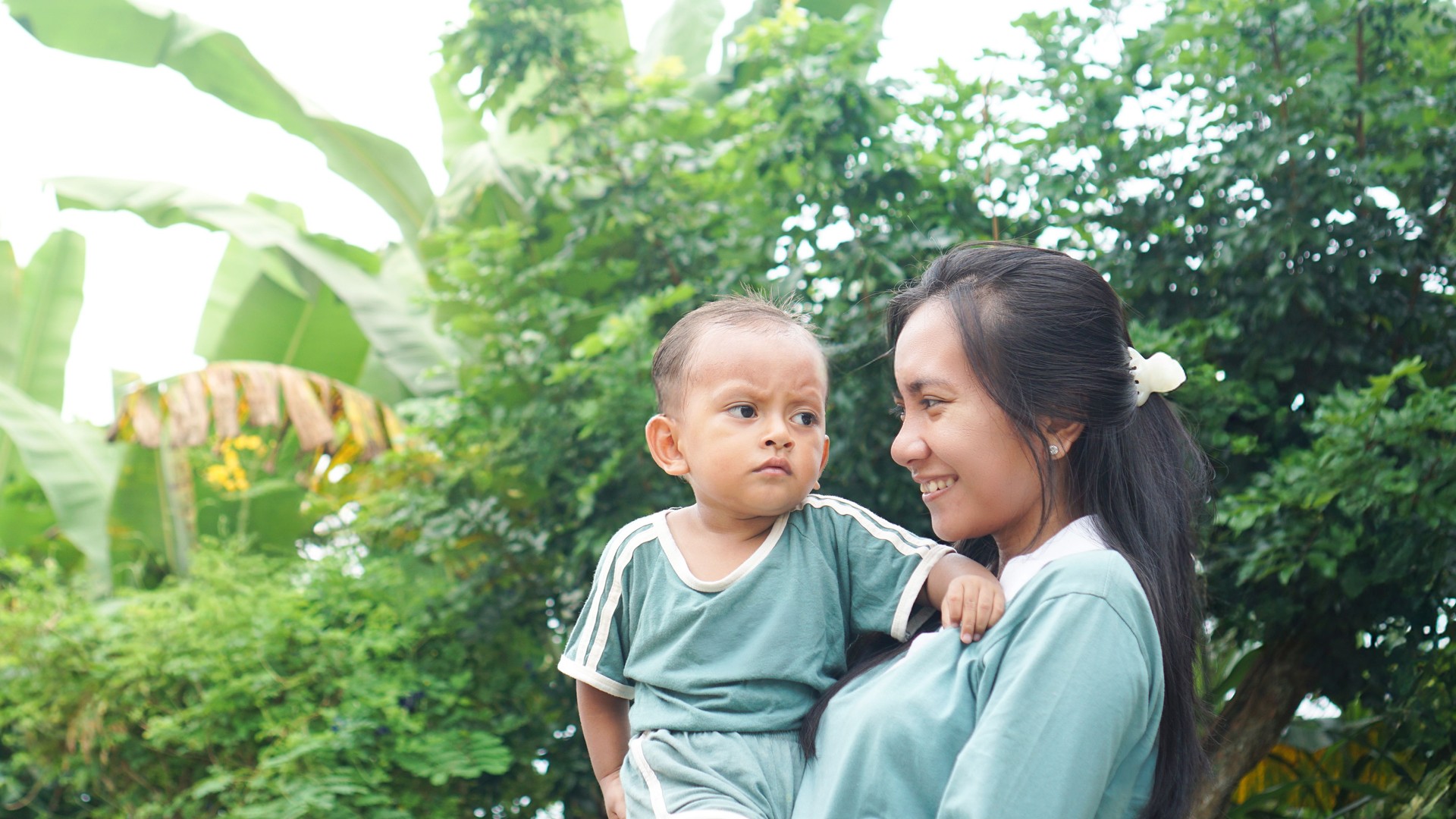 Mother and Child Sharing Moment in the Garden